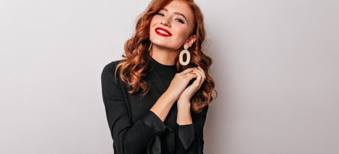 Big debonair stylish woman in black blouse smiling graceful european girl wears golden earrings 197531 11766